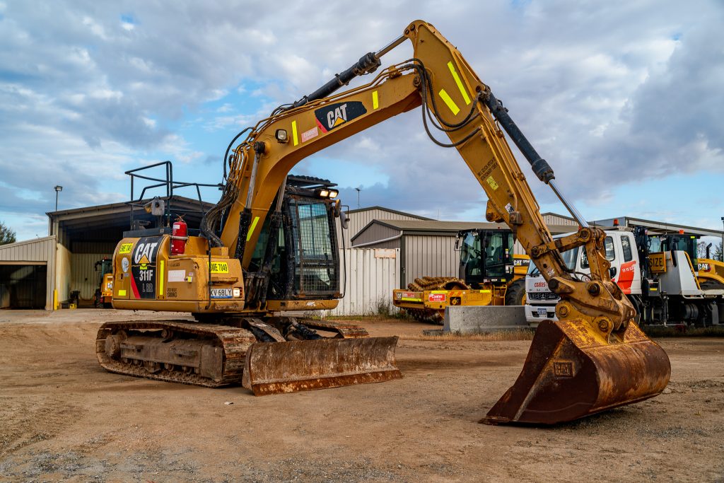 Wide-angle shot of a CAT 311F excavator and CAT 950H loader at Coates depot