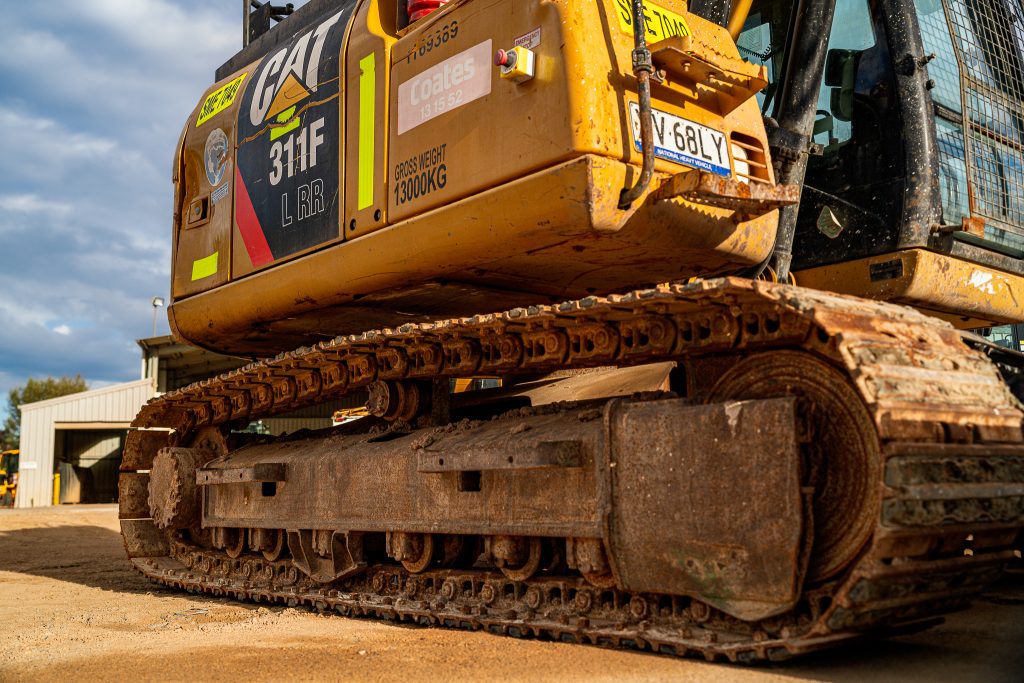 Rear angle of a CAT 950H loader at Coates depot, emphasizing its size and build.