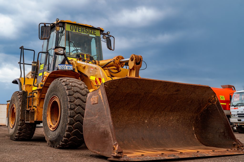 Close-up of the CAT 950H loader tire, showcasing its tread and durability.