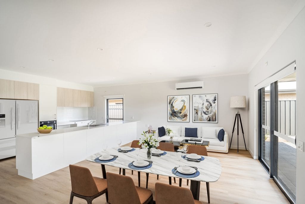 Modern open plan kitchen and dining area with natural light