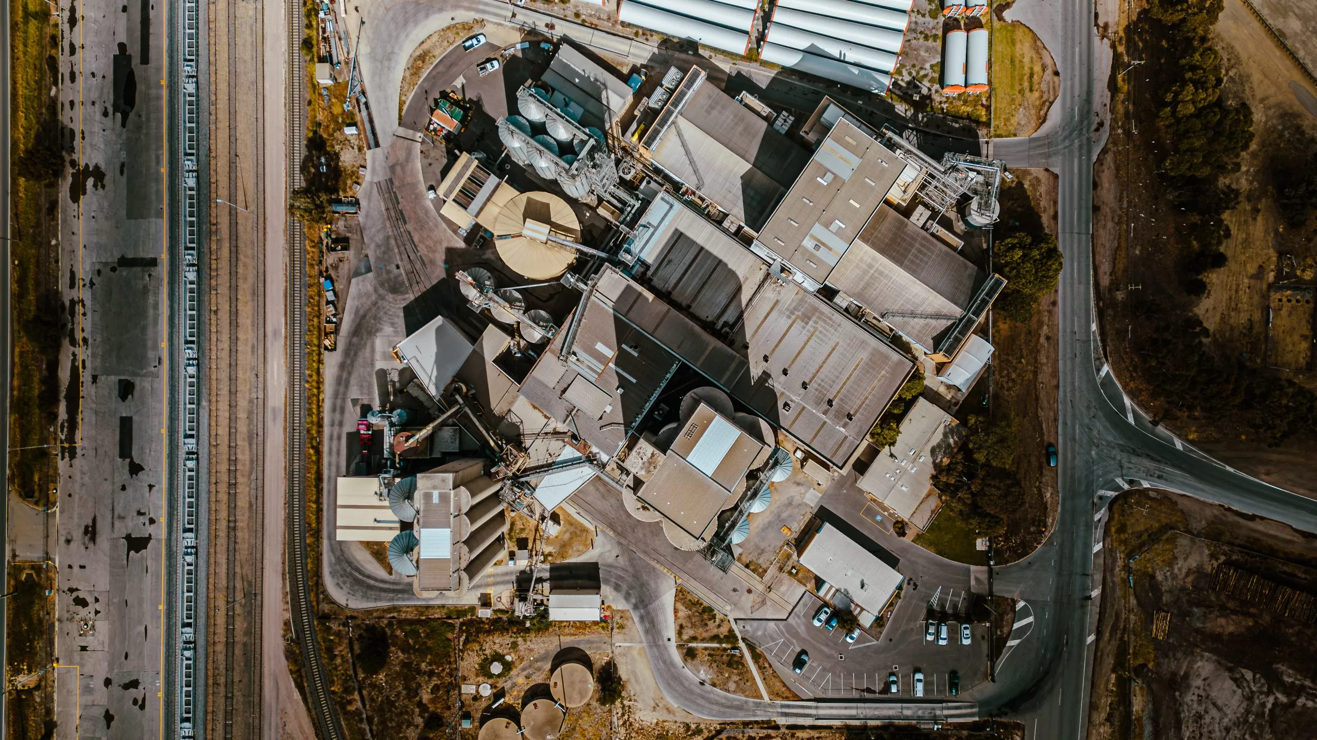 Aerial view of an industrial complex, showcasing Shameless Visuals' drone and industrial photography services